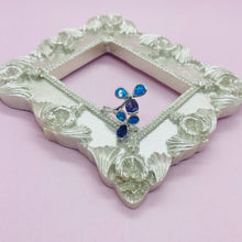 Load image into Gallery viewer, Sterling Silver Blue Synthetic Opal 3 Petal Flower Bypass Ring for Teardrop