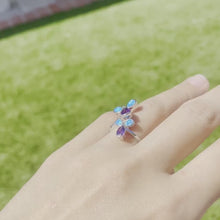 Load and play video in Gallery viewer, Sterling Silver Blue Synthetic Opal 3 Petal Flower Teardrop Bypass Ring
