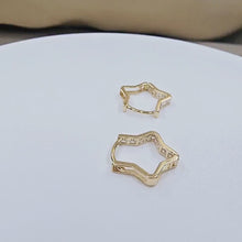 Load and play video in Gallery viewer, 14K Yellow Gold Star Shaped Huggies Hoop Earrings with CZ Stones
